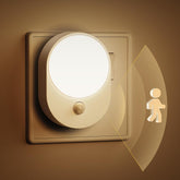 Warm white night light glowing in dark room